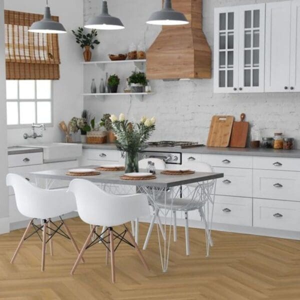 Warren oak herringbone laminate flooring installed in modern white kitchen