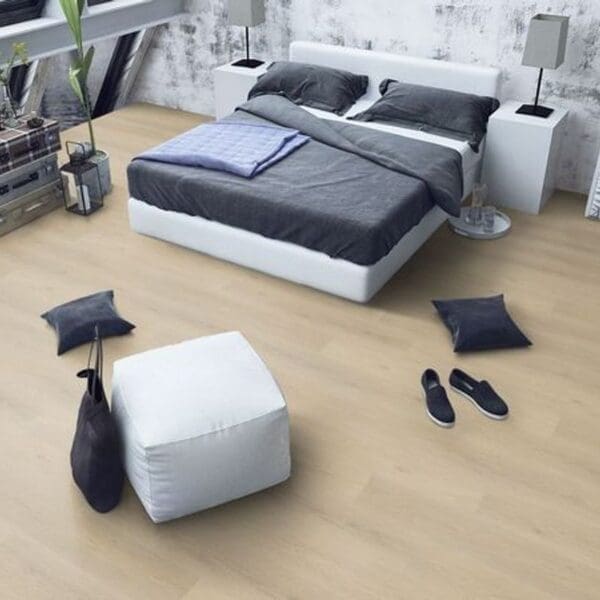 Denver oak laminate flooring in minimalist bedroom with white and gray decor
