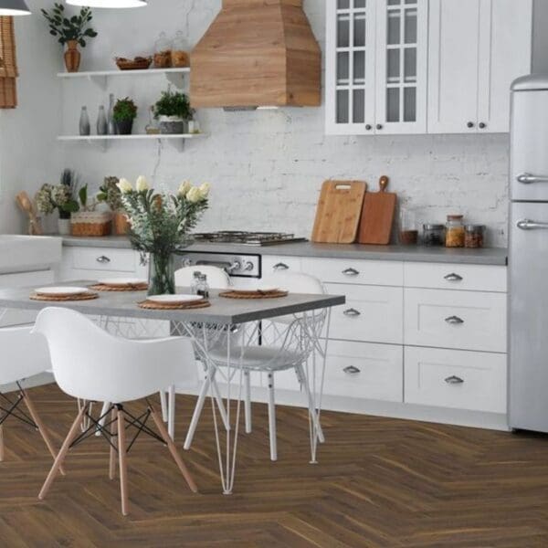 White kitchen with coffee oak herringbone laminate flooring and dining area