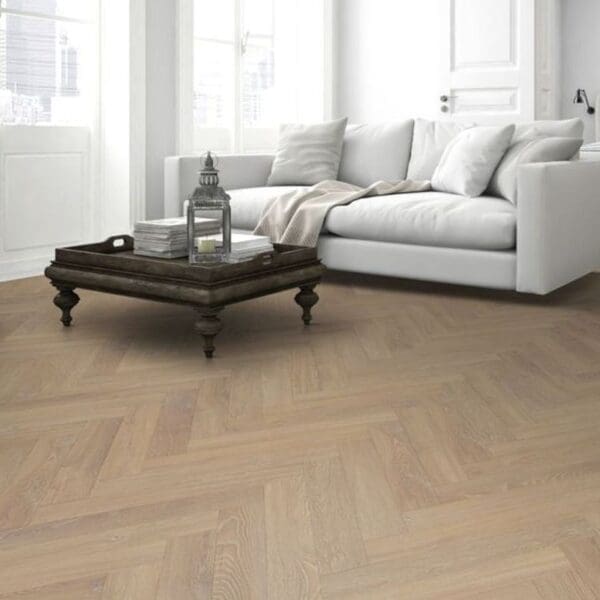 Cozy living space with fireplace and desert oak herringbone laminate flooring