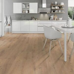 Lignum fusion oregon oak laminate flooring in white modern kitchen with dining area