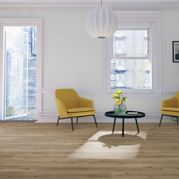 Albany oak laminate flooring in bright living room with yellow accent chairs