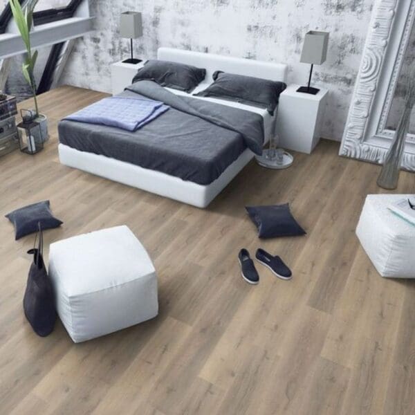 Greige oak laminate flooring in minimalist bedroom with white furniture and grey accents