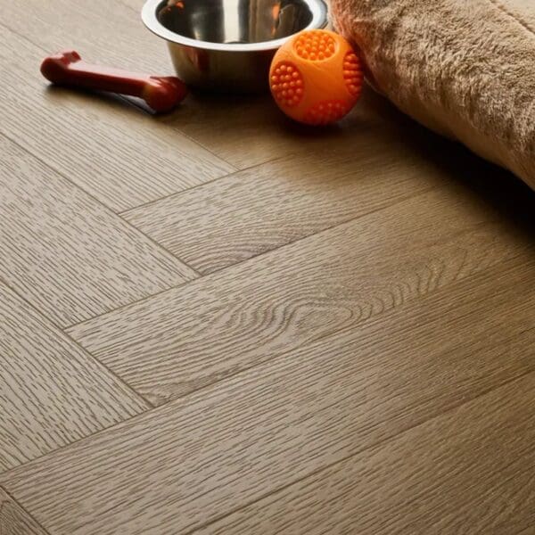 Textures country oak herringbone flooring installed in pet-friendly space with dog bowl and toys