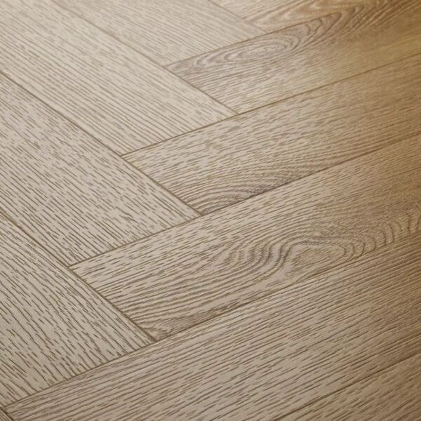 Close up view of textures country oak herringbone flooring showing detailed wood grain texture