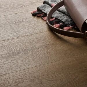 Textures light oak plank flooring with handbag and textile accessories