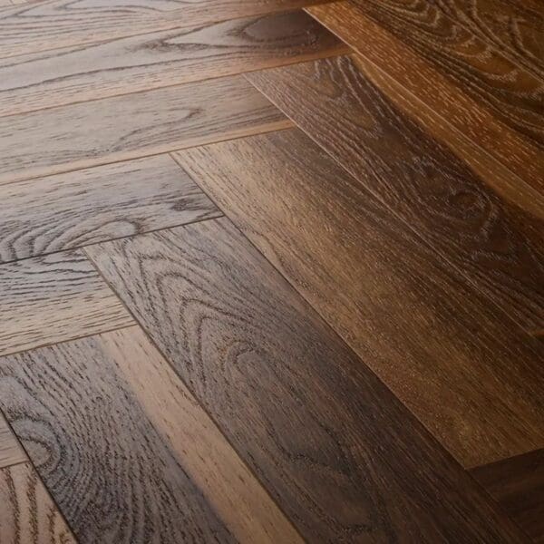 Close up view of textures warm walnut herringbone flooring showing detailed wood grain