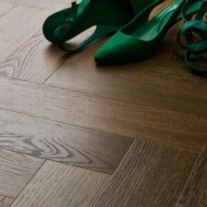Textures aged oak herringbone flooring with green shoes showing scale and styling