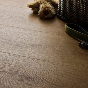 Textures country oak plank flooring in home setting with basket and toys