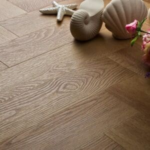 Textures summer oak herringbone flooring styled with seashells and flowers
