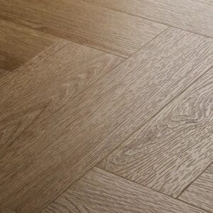 Close up view of textures light oak herringbone showing wood grain detail