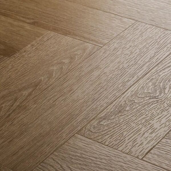Close up view of textures light oak herringbone showing wood grain detail