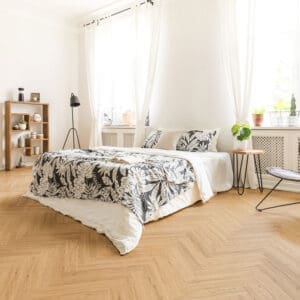 Tromso Herringbone LVT Honey Oak flooring - close-up showing texture and color