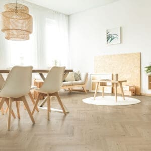 Tromso Herringbone LVT Woodland Fir flooring - detail view showing texture and color
