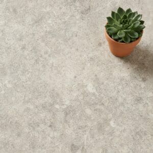 Amtico Spacia Abbey Stone luxury vinyl flooring close-up texture - photorealistic room shot
