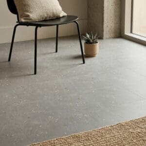 Amtico Spacia Cementa Bilbao luxury vinyl flooring detailed view - photorealistic room shot