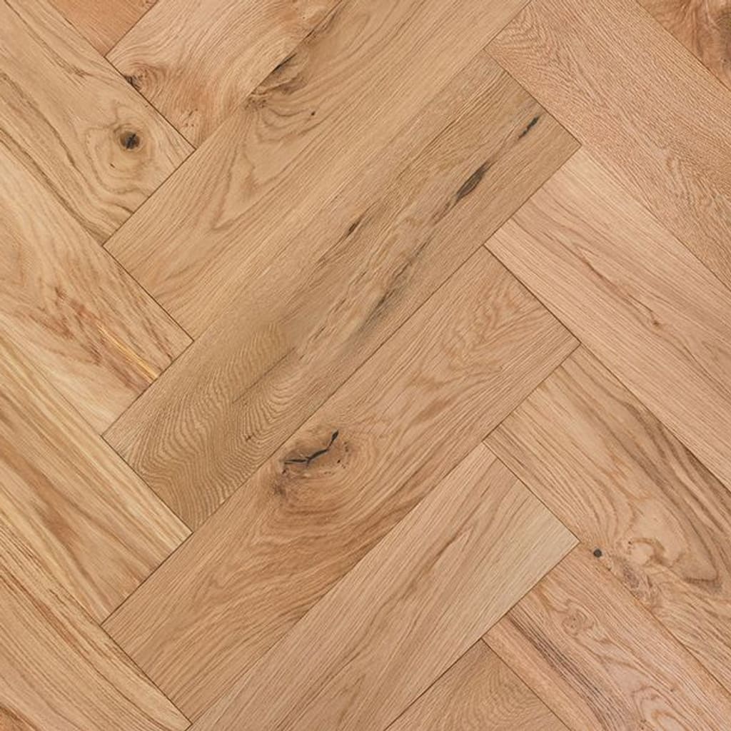 Baddiley Oak Herringbone engineered wood flooring showing a natural smooth oiled finish in a parquet pattern.