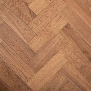 Close up of Bickerton Oak Herringbone engineered wood flooring showing brushed texture and antique lacquered finish