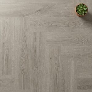 Brampton Chase Studio Designs Herringbone Pebble Shore luxury vinyl flooring close-up texture - photorealistic room shot