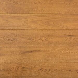 Close up of Brereton Oak engineered wood flooring showing golden tones and brushed grain texture