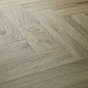 Elements Inspirations Dove Oak Herringbone EIH04 flooring close-up showing the herringbone pattern.