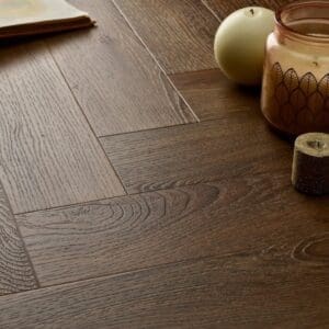 Elements Inspirations Espresso Herringbone EIH02 luxury vinyl flooring detail with candles