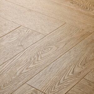 Close-up of Elements Inspirations Holm Oak Herringbone EIH10 luxury vinyl flooring showing wood grain detail.