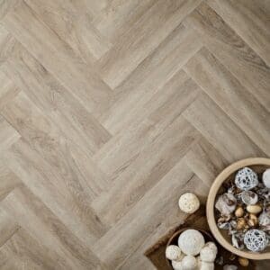 Elements Inspirations Limed Oak Herringbone EIH03 flooring with decorative bowls on top.