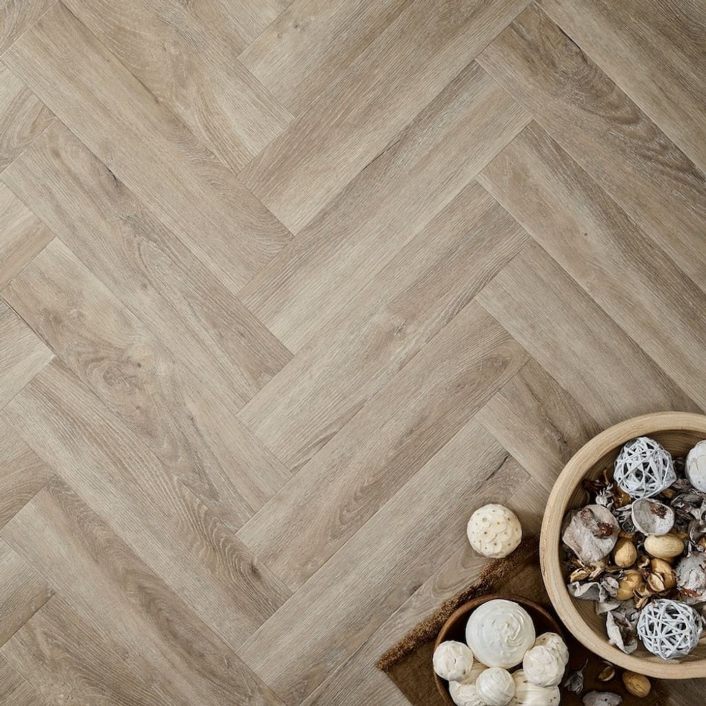 Elements Inspirations Limed Oak Herringbone EIH03 flooring with decorative bowls on top.