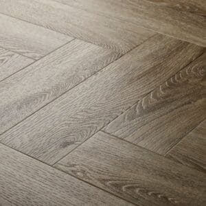 Elements Inspirations Limed Oak Herringbone EIH03 luxury vinyl flooring close up showing the herringbone pattern.