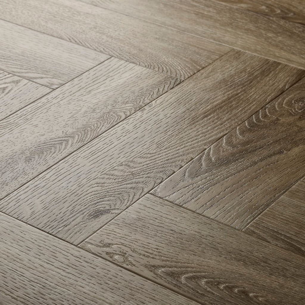 Elements Inspirations Limed Oak Herringbone EIH03 luxury vinyl flooring close up showing the herringbone pattern.