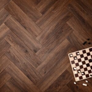 Elements Inspirations Mahogony Herringbone EIH06 luxury vinyl flooring with a chessboard.
