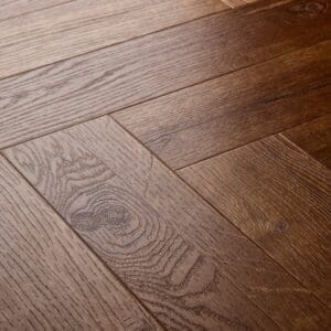 Elements Inspirations Royal Oak Herringbone EIH08 luxury vinyl flooring close-up showing wood grain detail.