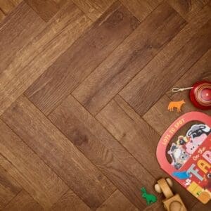 Elements Inspirations Royal Oak Herringbone EIH08 luxury vinyl flooring with children's toys