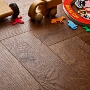 Elements Inspirations Royal Oak Herringbone EIH08 luxury vinyl flooring with children's toys