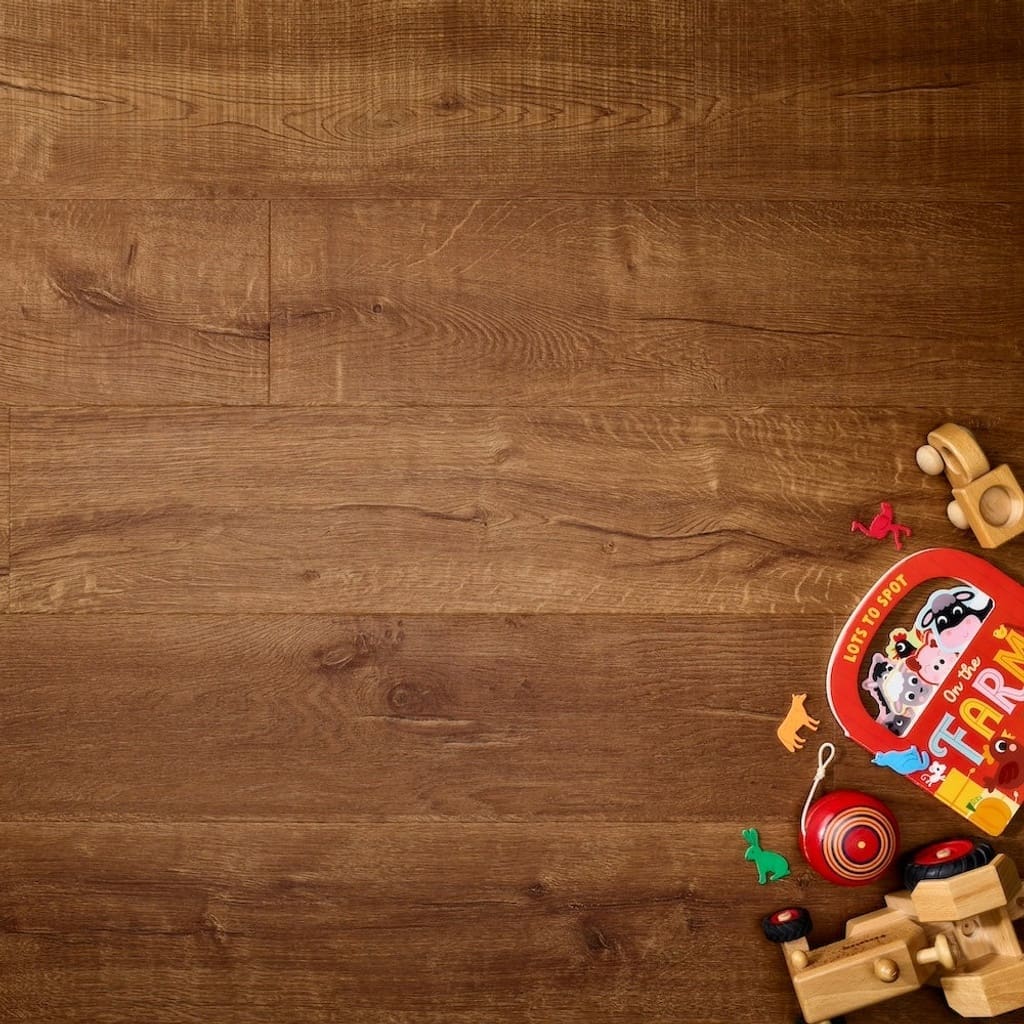 Elements Inspirations Royal Oak Plank EIP08 luxury vinyl flooring with toys and a book.