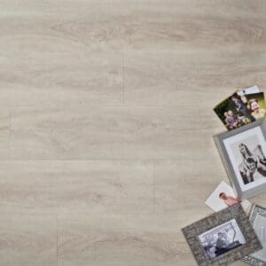 Elements Inspirations White Ash Plank EIP11 luxury vinyl flooring with family photos.