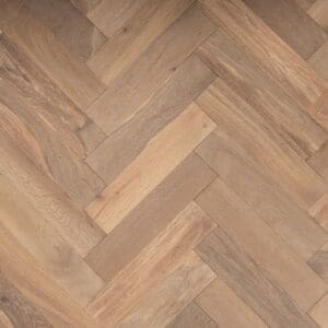 Frodsham oak herringbone engineered wood flooring with a smoked and brushed oiled finish in a traditional parquet pattern.