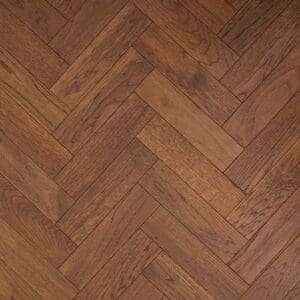 Overhead view of Hale Oak Herringbone engineered wood flooring showing the golden oak tones and parquet pattern.