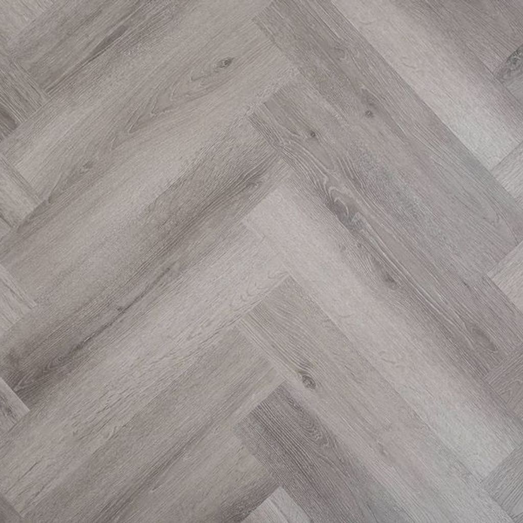 Kingham Oak Herringbone grey wood effect rigid core SPC flooring sample showing parquet pattern