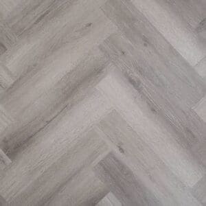 Kingham Oak Herringbone grey wood effect rigid core SPC flooring sample showing parquet pattern