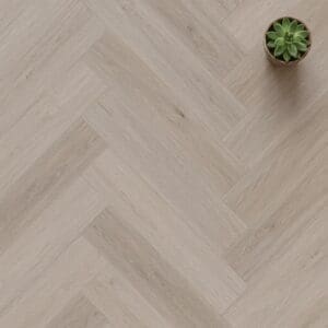 Norton Oak Herringbone luxury vinyl flooring close-up texture - photorealistic room shot