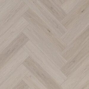Light grey oak effect herringbone SPC flooring planks arranged in a parquet pattern.