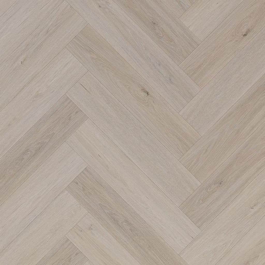 Light grey oak effect herringbone SPC flooring planks arranged in a parquet pattern.