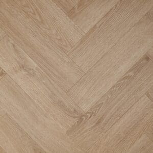 Textures Light Oak Herringbone TH10 luxury vinyl flooring close-up showing the herringbone pattern.