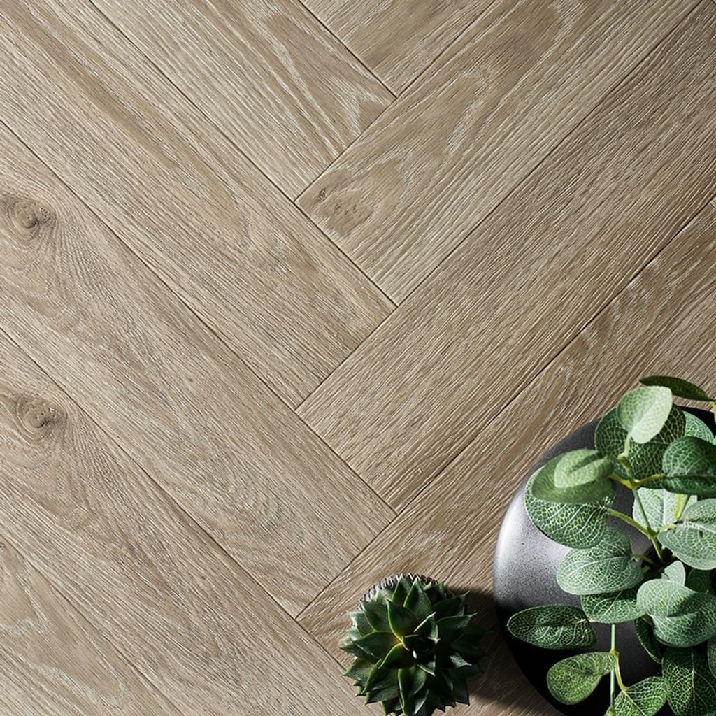 Textures LVT Ash Herringbone TH08 luxury vinyl flooring in a herringbone pattern with plants