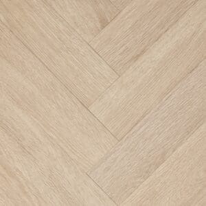 Close-up of Textures LVT Blonde Oak Herringbone TH09 luxury vinyl flooring showing the herringbone pattern.