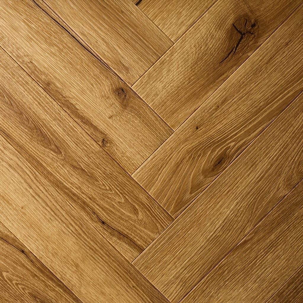 Textures LVT Honey Oak Herringbone TH07 flooring close-up showing the herringbone pattern.