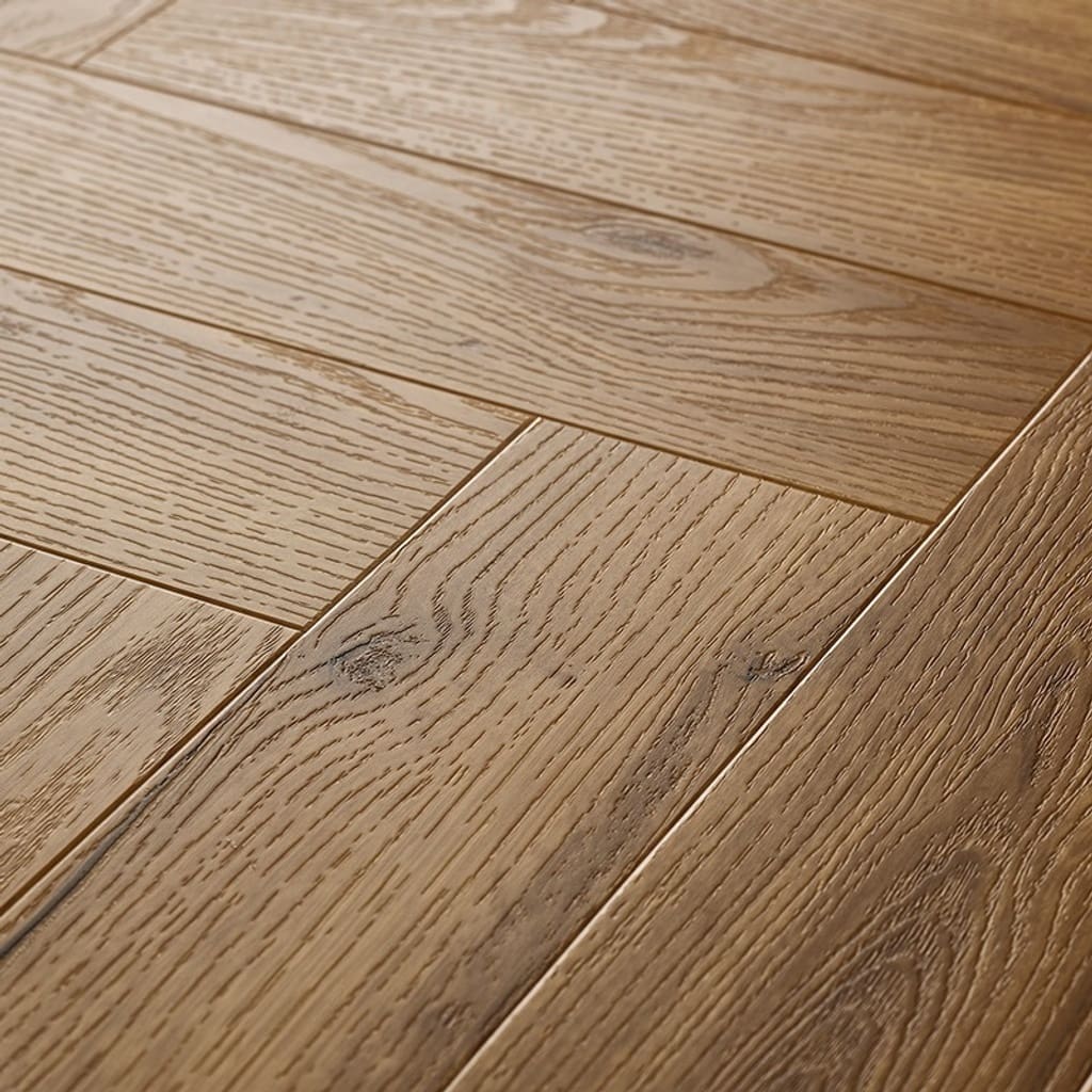 Close up of installed Textures LVT Honey Oak Herringbone TH07 luxury vinyl flooring