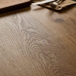 Close-up of Textures LVT Honey Oak Plank TP07 showing the wood grain texture.